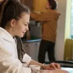 Shallow Focus Photo of Woman Using a Laptop