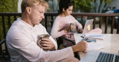 Man in White Dress Shirt Holding Silver Cup